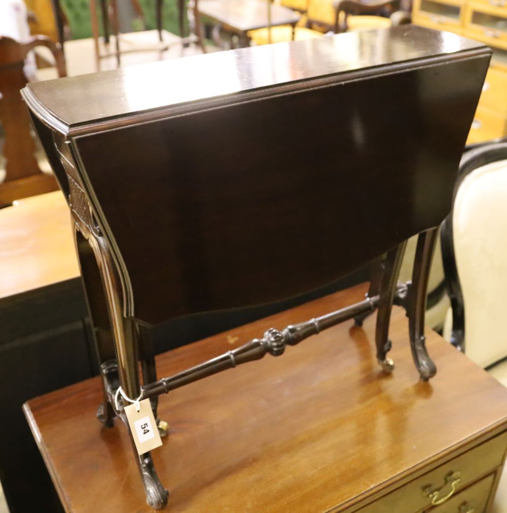 A late Victorian mahogany Sutherland table with shaped top on carved underframe, width 63cm depth 17cm height 59cm